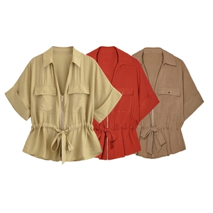 Detail of waist drawstring and metal zipper on casual utility jackets in three colors