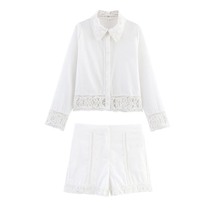 Detailed view of white crochet lace trim on long sleeve shirt and matching shorts set