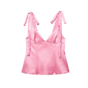 Pink satin V-neck camisole featuring elegant shoulder bow ties and glossy finish
