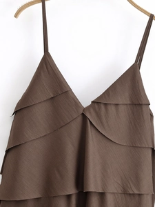 Detailed view of brown layered camisole featuring ruffled tiers and textured fabric