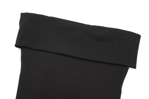 Detail shot of the black zip-up top showing the wide-folded collar and fabric texture