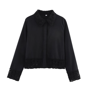 Detailed view of women's black long-sleeve shirt with intricate crochet lace collar and cuffs
