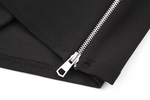 Detailed macro view of high-quality silver metal zipper on black woven top fabric