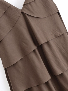 Detail shot of the deep brown tiered fabric layers and fine horizontal texture