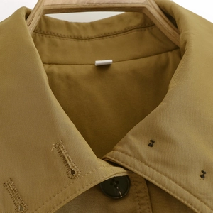Minimalist mustard yellow spring flight jacket with lapel and marble pattern button