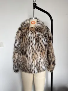 Close-up of fluffy leopard print faux fur texture and warm winter coat material