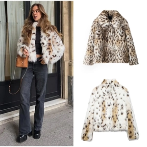 Detail of faux fur leopard print jacket with large lapels and plush texture