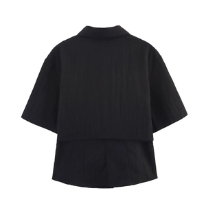 Detail view of the black short sleeve shirt featuring a double-layered back design