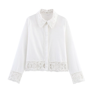 Detailed view of white cotton shirt featuring intricate crochet lace hems and cuff trim