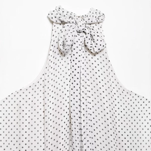 Polka dot halter neck dress with a large bow detail for women in 2025 spring collection