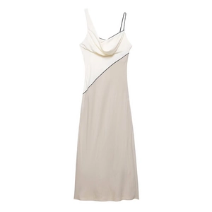 Detail of elegant cream and khaki patchwork midi dress with silky satin texture and strap
