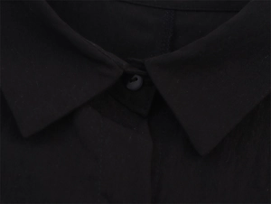 Detail of black double-layered shirt collar with turn-down design and single button