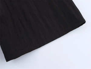 Macro detail of high-quality double-layered black fabric with fine twill texture and stitching