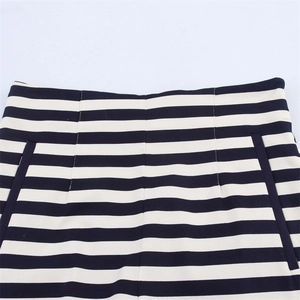 Detailed close-up of high-waisted striped shorts with reinforced seams and functional pockets