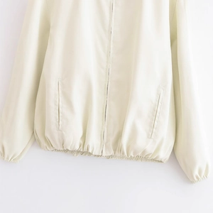 Minimalist cream white zip-up jacket for women with elastic cuffs and smooth finish