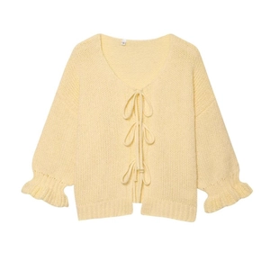 Light yellow knit cardigan with V-neck, ribbon bow ties and elegant ruffled cuffs