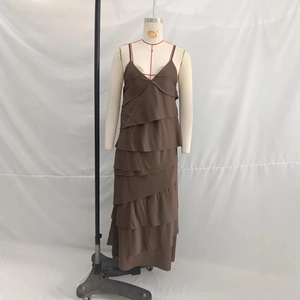 Brown tiered ruffle maxi dress with spaghetti straps and layered flowy silhouette