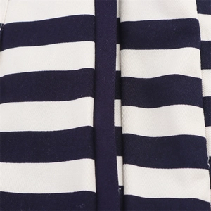 Macro shot of navy blue and white striped cotton canvas fabric with reinforced stitching