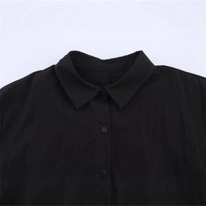 Classic black short sleeve button-down shirt featuring a sharp collar and minimalist design