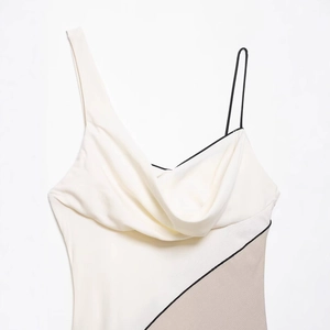 Minimalist cream asymmetric midi dress with black piping and tan color-block design
