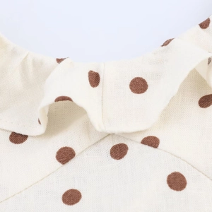 Polka dot midi dress with ruffle collar and beige linen texture fabric detail