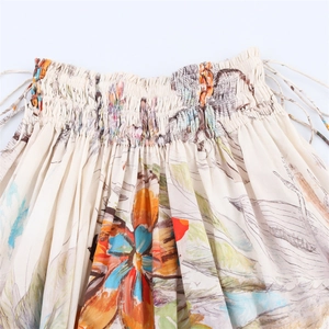 Floral print midi skirt with elastic smocked waist and side drawstring detail