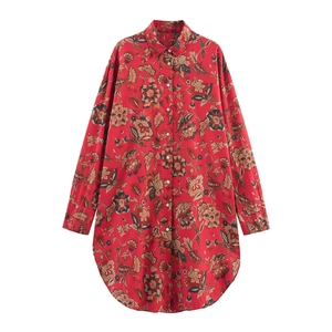 Detail of red floral print long-sleeve shirt showing classic collar and button closure