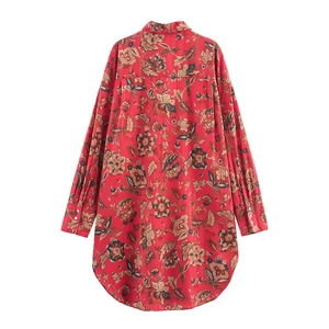 Detailed back view of a long-sleeved floral print shirt with a curved hemline