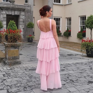 Pink tiered chiffon maxi dress with open back and 3D floral accents for spring events