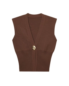 Close-up of the deep V-neck and decorative gold buckle on the brown knit vest