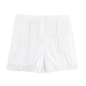 Detailed view of white crochet lace trim on lightweight cotton linen shorts for women