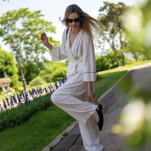 Women's two-piece white summer set with contrast piping and wide-leg pants