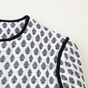 Quilted cotton jacket with navy leaf print and contrast black trim detailing