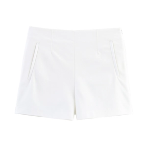 Detailed close-up of high-waisted white wide-leg shorts with precise front dart tailoring