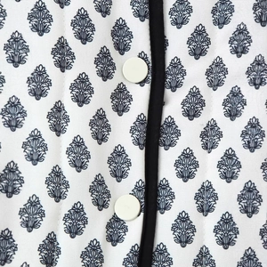 Women's quilted cotton jacket featuring vintage leaf print and contrast black piping