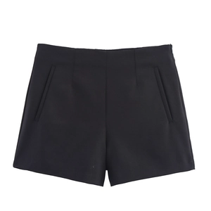 Close-up of high-waisted black tailored shorts featuring side zipper and vertical pockets