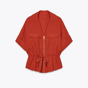 Women's rust red short sleeve shirt with waist drawstring and front zipper details