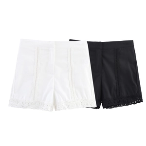 Women's high waist shorts featuring intricate white and black crochet lace details