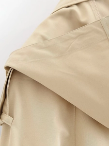 Detailed close-up of khaki twill jacket collar and shoulder with neat stitching