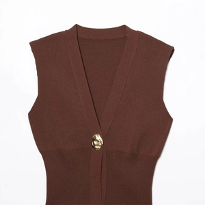 Brown V-neck knit vest featuring a unique gold button on high-quality knit fabric