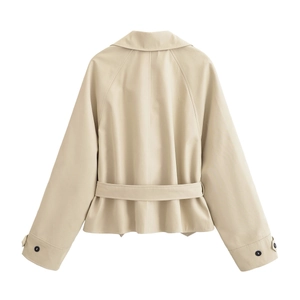 Rear view of beige short trench coat with waist belt and raglan sleeve detailing