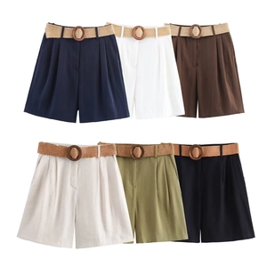 Detail view showing high waist pleated Bermuda shorts with straw belts in six diverse colors