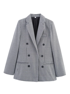 Detail of classic black and white houndstooth blazer with double-breasted buttons