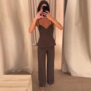 Brown two-piece set featuring a V-neck peplum camisole top and high-waisted wide-leg pants
