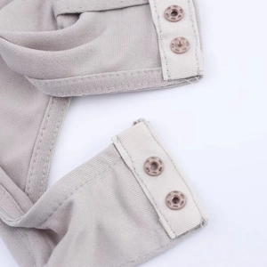 Elegant light gray halter top bodysuit with snap button closure details on high quality fabric