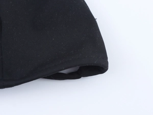 Macro shot of the black triangle bikini set edge showing detailed piping and fabric texture