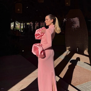 Pink slim-fit high-neck maxi dress with voluminous puff sleeves and high side slit