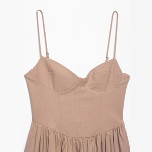 Elegant khaki backless maxi dress with spaghetti straps and pleated skirt for summer 2025
