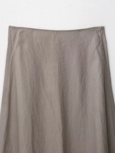 Detail of taupe A-line linen skirt featuring invisible side zipper and quality stitching