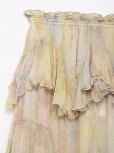 Detailed view of elastic ruffled waist and layered watercolor print chiffon skirt